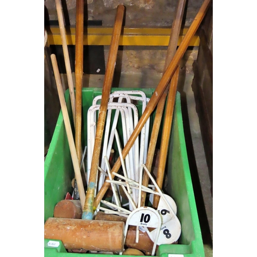 1121 - A collection of vintage croquet equipment to include markers, hoops, balls, etc