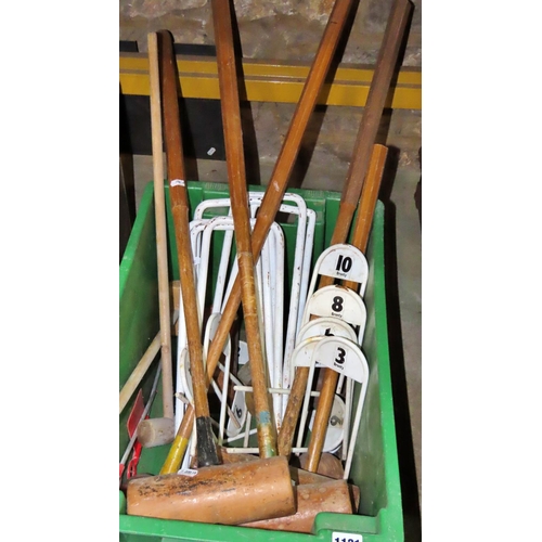 1121 - A collection of vintage croquet equipment to include markers, hoops, balls, etc