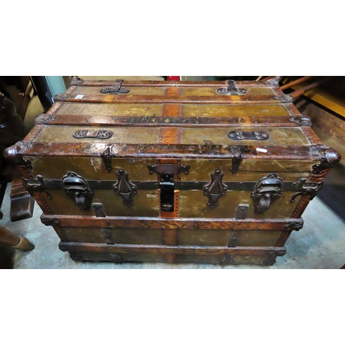 1122 - A 19th century American wooden lathe banded steamer trunk with steel fittings, raised on later casto... 