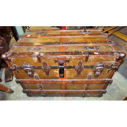 1122 - A 19th century American wooden lathe banded steamer trunk with steel fittings, raised on later casto... 