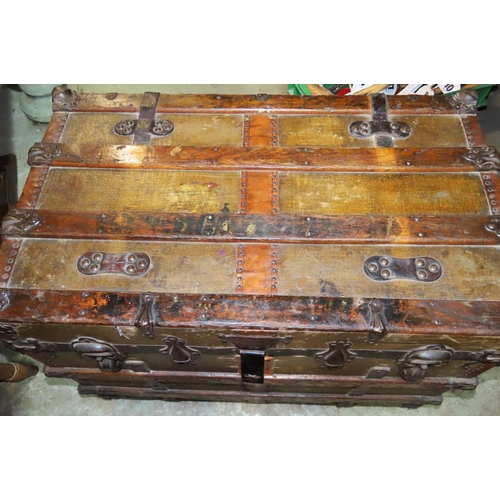 1122 - A 19th century American wooden lathe banded steamer trunk with steel fittings, raised on later casto... 