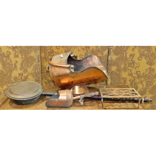 1145 - A copper coal scuttle, shovel, warming pan and brass trivet