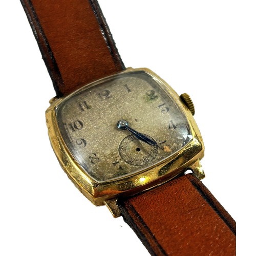 320 - Rolex: A gentleman’s vintage 9ct yellow gold cased wristwatch, the rounded squared silvered dial wit... 