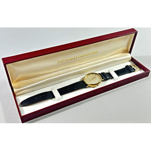 313 - Geneve: A gentleman’s vintage gold plated wristwatch with date aperture, 33mm case, inscribed to bac... 