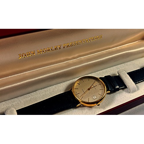 313 - Geneve: A gentleman’s vintage gold plated wristwatch with date aperture, 33mm case, inscribed to bac... 