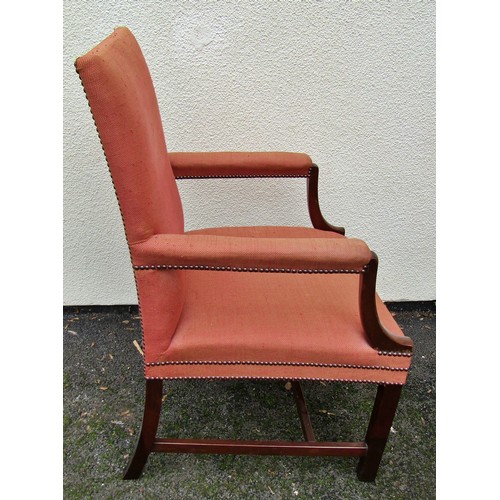 1495 - A Gainsborough elbow chair with mahogany frame on brick red upholstery