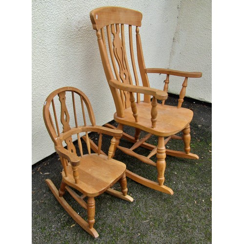 1501 - Two contemporary Windsor rocking chairs, full size and a child's size, both with pierced splats