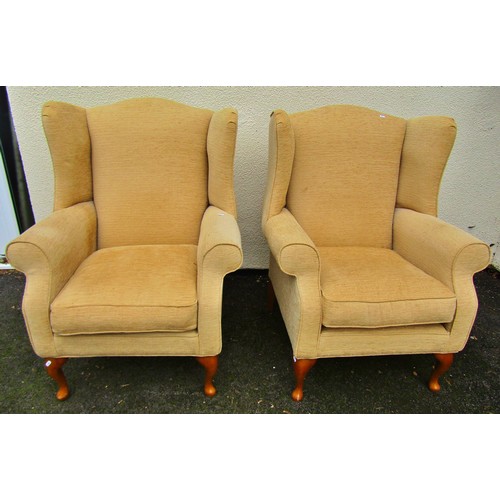 1487 - A Pair of Georgian style wing chairs in a pale mustard upholstery on cabriole supports, together wit... 