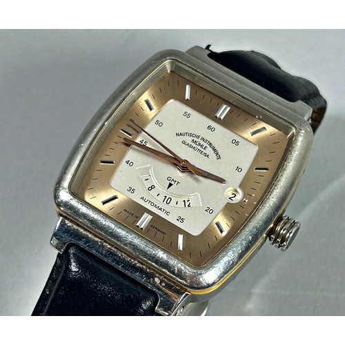 325 - Mühle Glashütte. A gentleman’s GMT wristwatch with two-tone dial and date aperture, 37cm case, Ref M... 