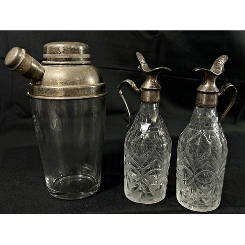 200 - A vintage glass and silver plated cocktail shaker together with a paint vinaigrette bottles with sil... 