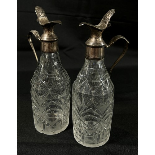 200 - A vintage glass and silver plated cocktail shaker together with a paint vinaigrette bottles with sil... 