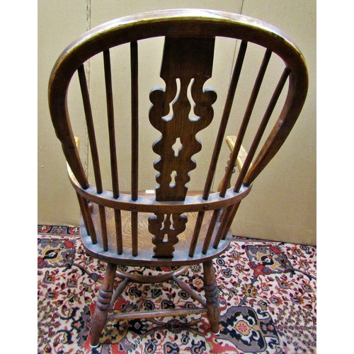 1406 - A Georgian Windsor elbow chair in elm and ashwood