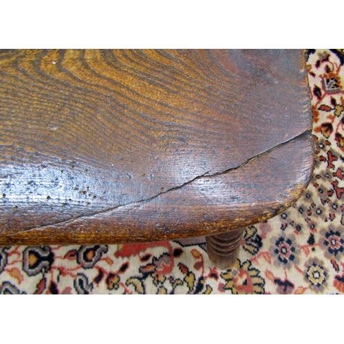 1406 - A Georgian Windsor elbow chair in elm and ashwood