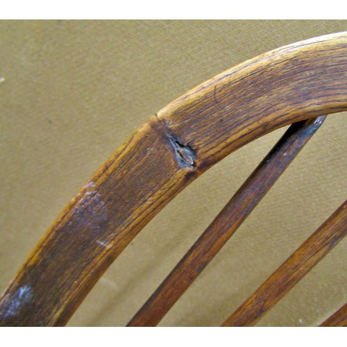 1406 - A Georgian Windsor elbow chair in elm and ashwood