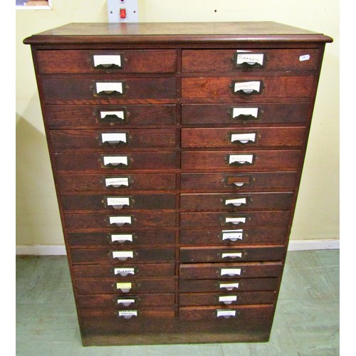 1555 - A vintage oak floor standing office filing/collectors cabinet fitted with a side by side arrangement... 