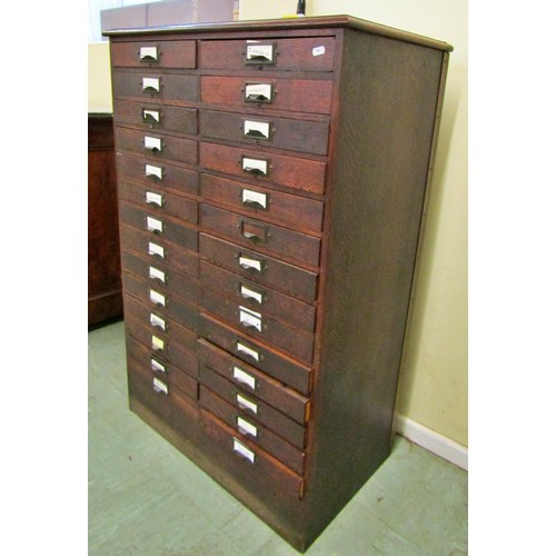 1555 - A vintage oak floor standing office filing/collectors cabinet fitted with a side by side arrangement... 