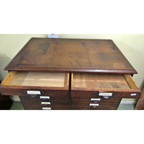 1555 - A vintage oak floor standing office filing/collectors cabinet fitted with a side by side arrangement... 