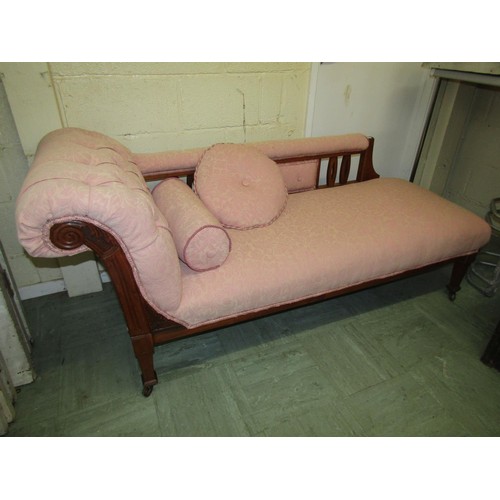 1562 - A Edwardian chaise longue with upholstered finish