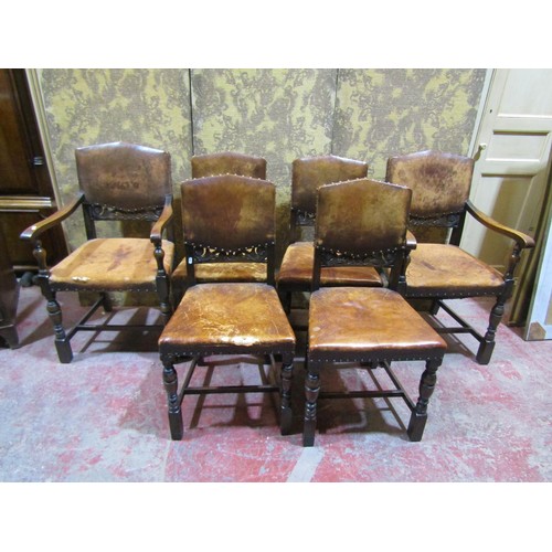 1563 - A set of six oak chairs in the Cromwellian style with hide upholstery (4&2)