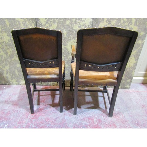 1563 - A set of six oak chairs in the Cromwellian style with hide upholstery (4&2)