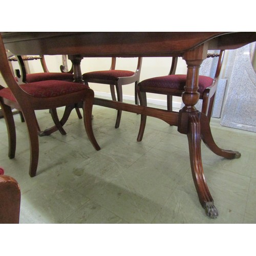 1566 - Reproduction Georgian style dining suite comprising a twin pillar table and six (4+2) sabre leg dini... 