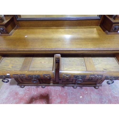 1569 - Late Victorian/Edwardian oak mirror back sideboard with raised mirror back over an arrangement of cu... 