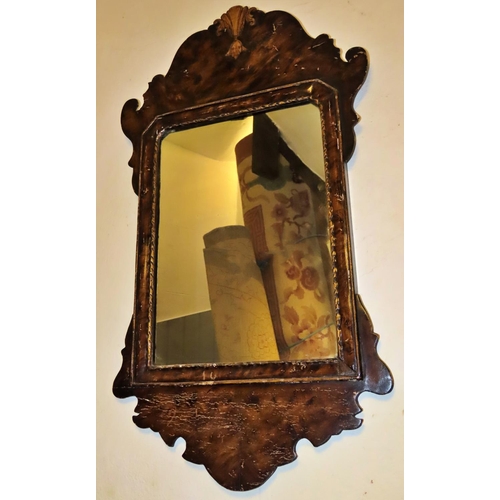 1314 - A small Georgian style wall mirror with fret 
carved outline, 67cm x 38cm