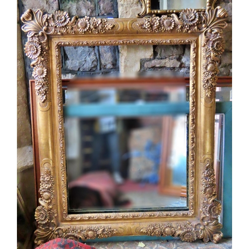 1316 - A large contemporary gilt mirror or picture frame, with foliate detail, 142cm x 116cm approx