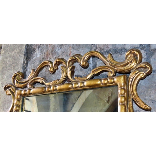 1317 - A gilt framed wall mirror, with open scrolling acanthus surround, 74cm x 48cm