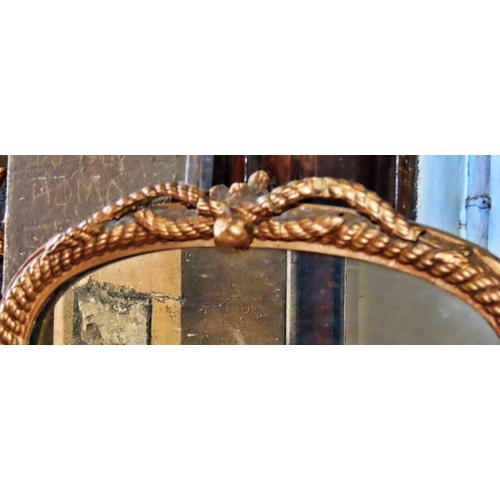 1318 - A pair of 19th century rope twist wall mirrors of slender arched form, (af) 63cm x 36cm