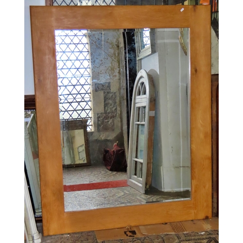 1322 - A large contemporary wall mirror, with bevelled edge plate in a simple oak frame, 150cm x 120cm