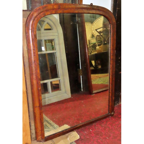 1323 - A Victorian walnut over mantel mirror the moulded arched frame with banded detail, 110cm x 86cm (af)