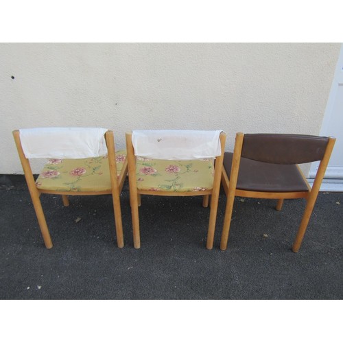 1575 - A pair of vintage Ercol tables, the elm tops raised on circular supports, 1222cm long x 69cm wide, t... 