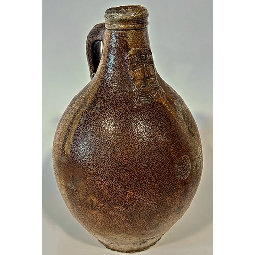 82A - A large 18th century Bellarmine salt glazed jug with distinctive bearded man impression to the neck,... 