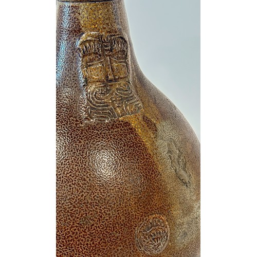 82A - A large 18th century Bellarmine salt glazed jug with distinctive bearded man impression to the neck,... 