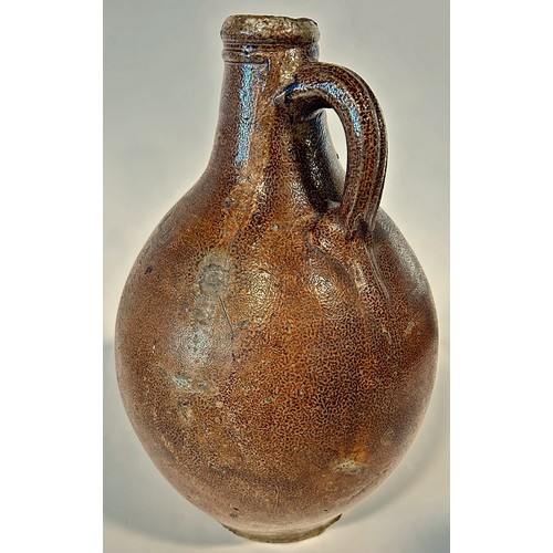 82A - A large 18th century Bellarmine salt glazed jug with distinctive bearded man impression to the neck,... 