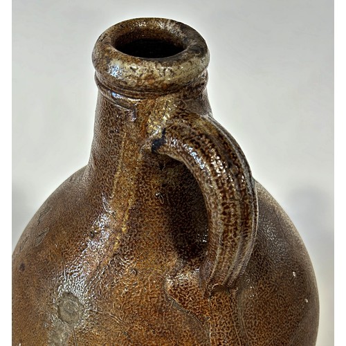 82A - A large 18th century Bellarmine salt glazed jug with distinctive bearded man impression to the neck,... 