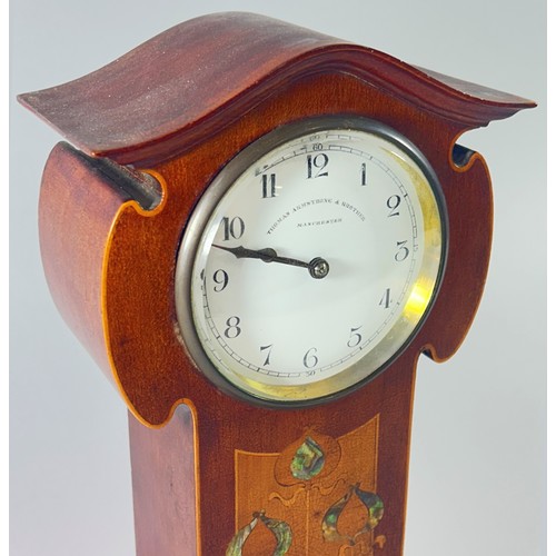 344 - An Edwardian mahogany mantle clock in the Art Nouveau style, the enamelled dial with black Arabic nu... 