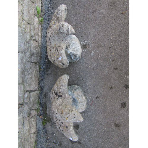 1049 - Pair of weathered cast composition stone eagles, 50cm high