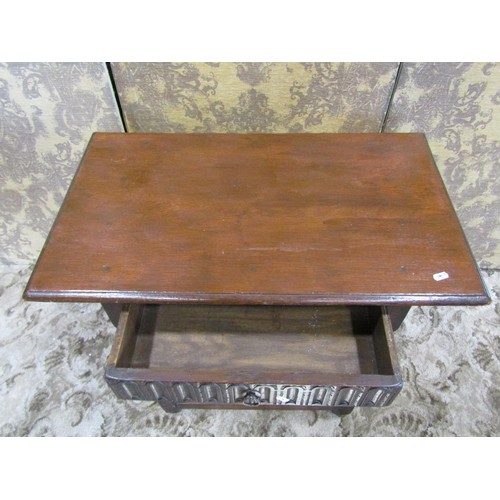 1211 - A reproduction oak monks seat with circular top and carved detail, together with an Old English styl... 