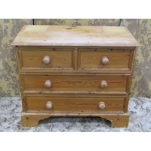 1165 - Small stripped pine bedroom chest of two long and two short drawers, raised on bracket supports, 70c... 