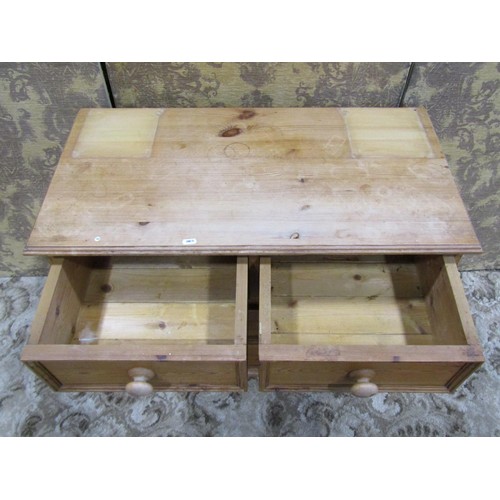 1165 - Small stripped pine bedroom chest of two long and two short drawers, raised on bracket supports, 70c... 