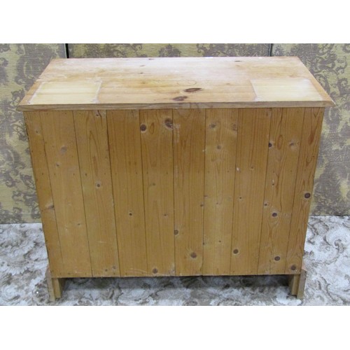 1165 - Small stripped pine bedroom chest of two long and two short drawers, raised on bracket supports, 70c... 