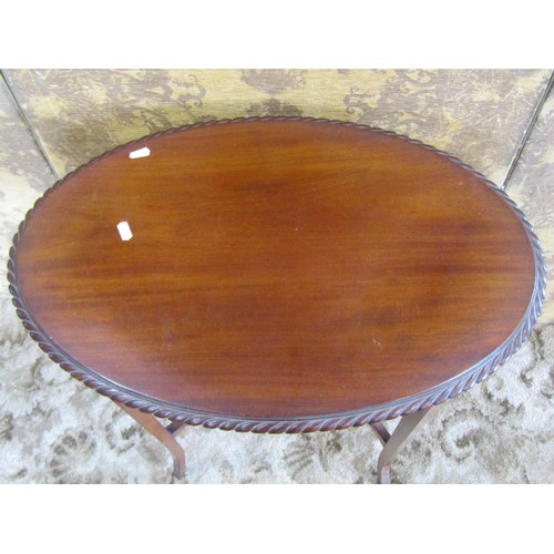 1135 - Edwardian mahogany two-tier occasional table of oval form, together with a towel rail, a side cabine... 