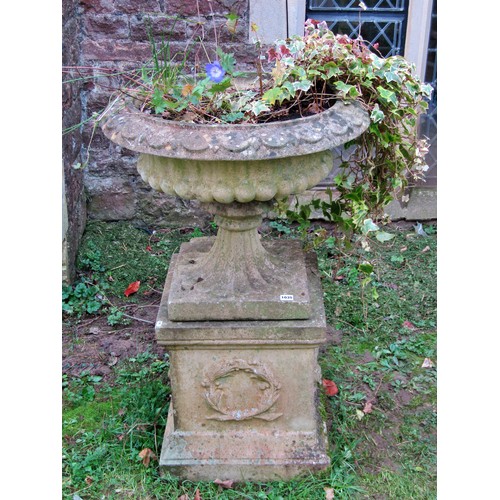 1035 - Weathered cast composition stone garden urn, the squat circular lobed bowl with flared rim and loose... 