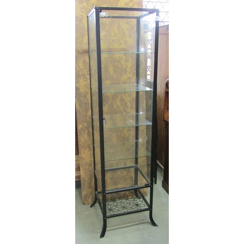 1175 - A contemporary light steel framed free standing shop display cabinet of square cut form raised on sp... 