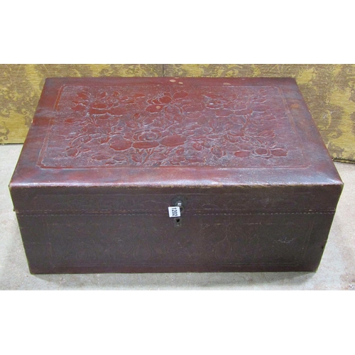 1202 - A Chinese leather overlaid trunk with embossed floral detail, 26cm high x 66cm x 44cm