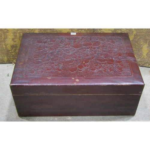 1202 - A Chinese leather overlaid trunk with embossed floral detail, 26cm high x 66cm x 44cm