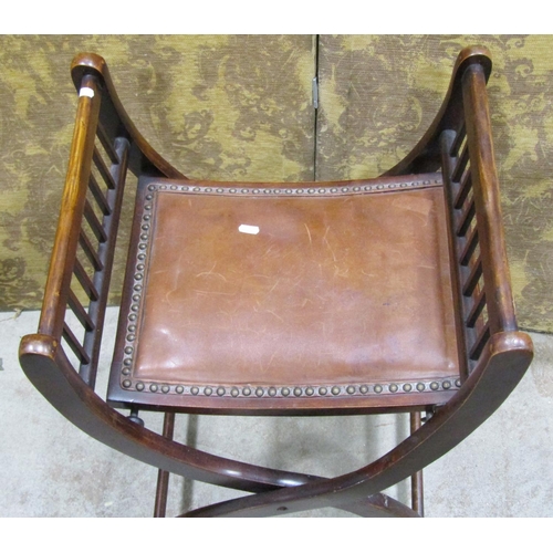 1219 - An Edwardian folding X framed stool with studded leather upholstered seat, 69cm high x 46cm x 42cm