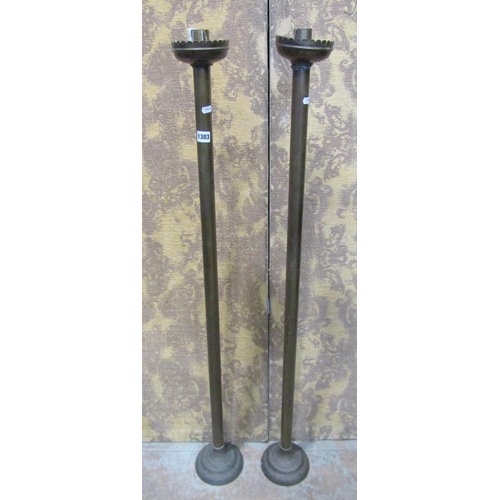 1303 - A pair of ecclesiastical floor standing candlesticks, 124cm high